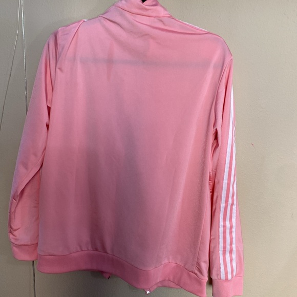 This is a pinkish-coral Adidas jacket that’s pink and white - Picture 2 of 2